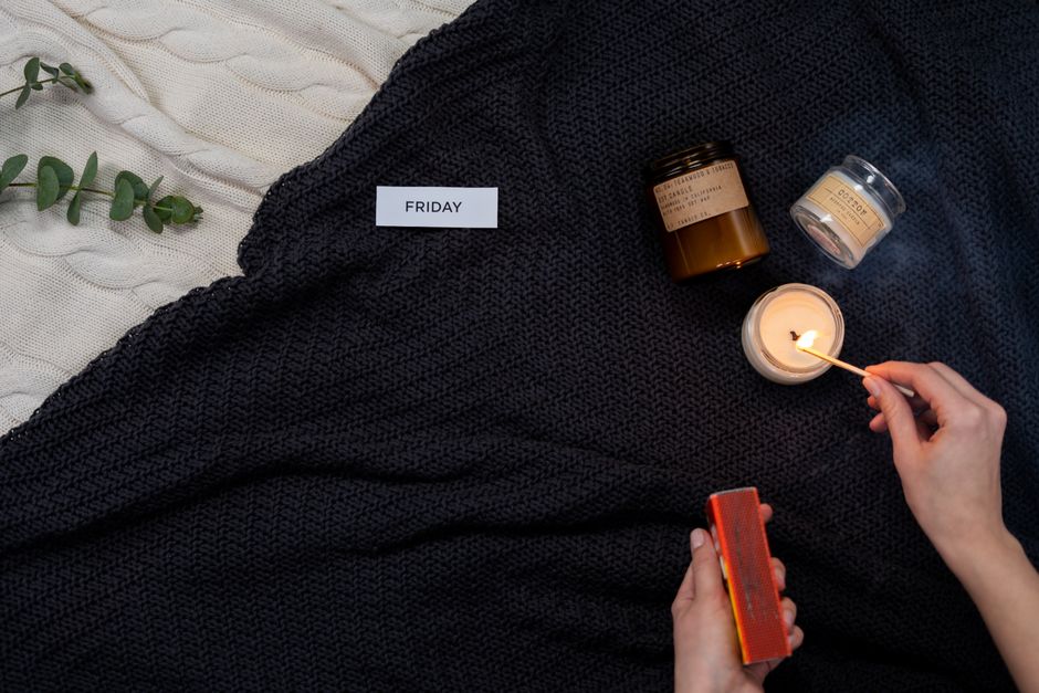 A serene setup with candles and blanket, evoking calm and relaxation.